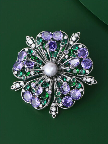 Floral brooch with freshwater pearls and zirconia a perfect accessory for evening gowns.